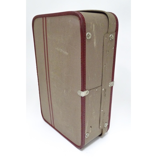 225 - Two mid 20thC suitcases, the largest example constructed from canvas with bamboo binding,  approx 24... 