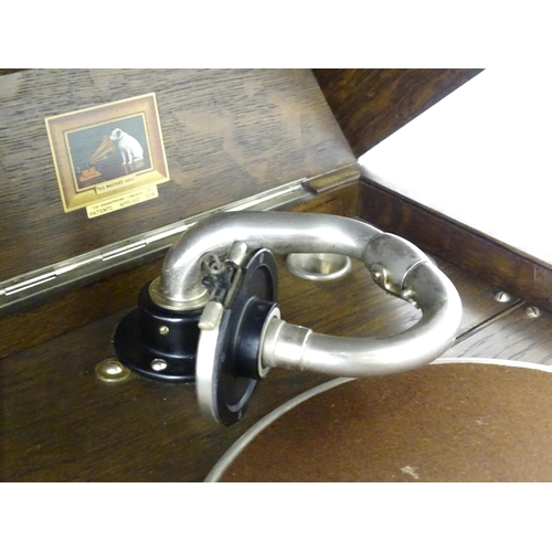 227 - An early to mid 20thC 'His Master's Voice /The Gramophone Company' gramophone in oak case, approx 18... 