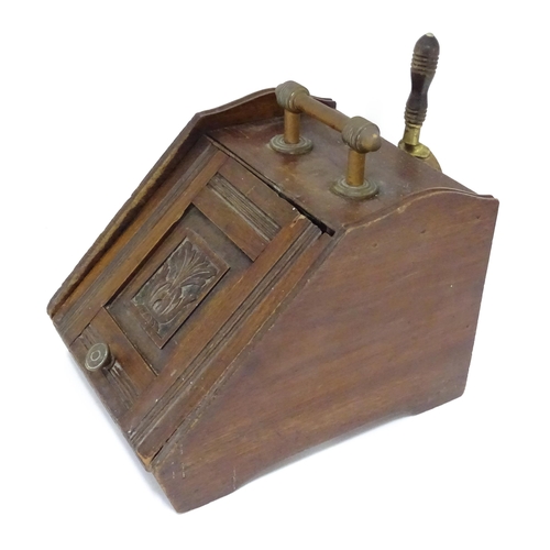 230 - A early 20thC oak coal scuttle with carved foliate decoration to the lid, with two shovels, poker et... 