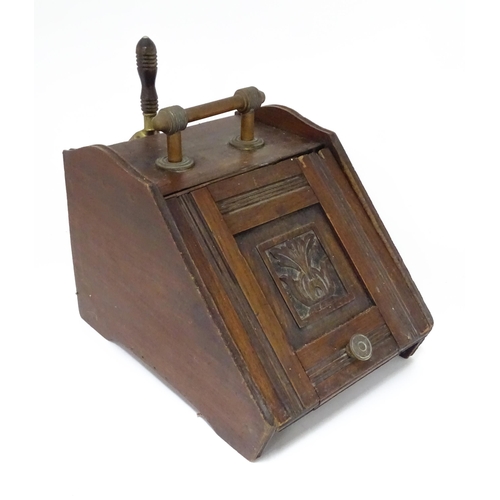 230 - A early 20thC oak coal scuttle with carved foliate decoration to the lid, with two shovels, poker et... 