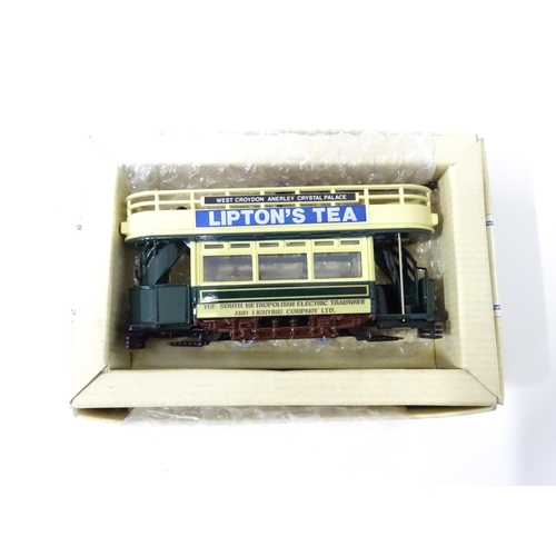 236 - Toys: six assorted model trams By Atlas Editions and Corgi, and a trolleybus by Days Gone By. The la... 