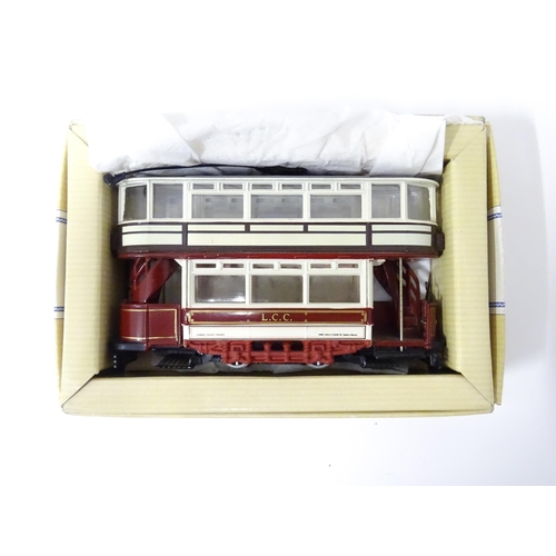 236 - Toys: six assorted model trams By Atlas Editions and Corgi, and a trolleybus by Days Gone By. The la... 