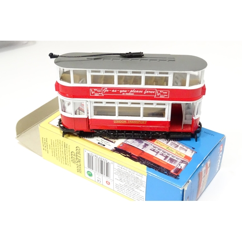 236 - Toys: six assorted model trams By Atlas Editions and Corgi, and a trolleybus by Days Gone By. The la... 