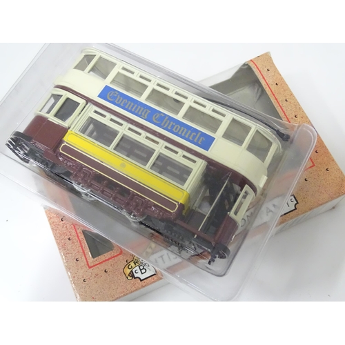 236 - Toys: six assorted model trams By Atlas Editions and Corgi, and a trolleybus by Days Gone By. The la... 