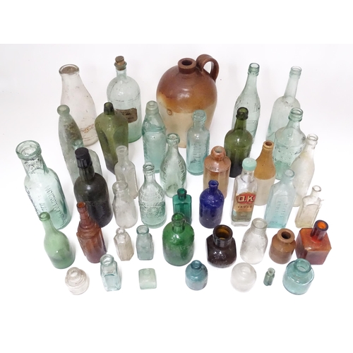 244 - A quantity of old bottles to include gingerbeers, codd, Princes Risborough milk bottle with original... 