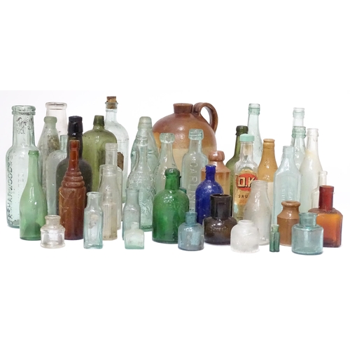 244 - A quantity of old bottles to include gingerbeers, codd, Princes Risborough milk bottle with original... 