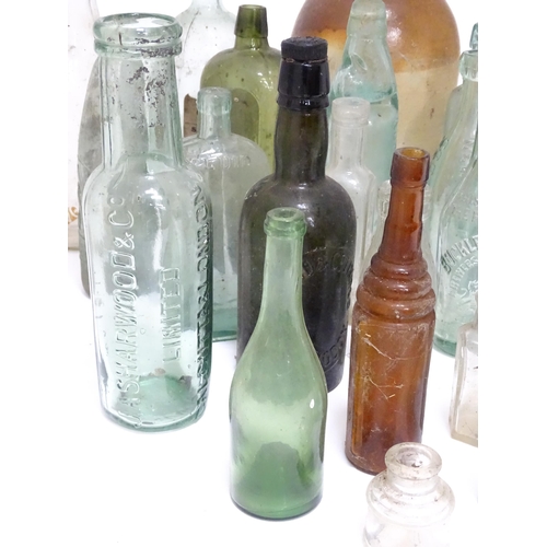 244 - A quantity of old bottles to include gingerbeers, codd, Princes Risborough milk bottle with original... 