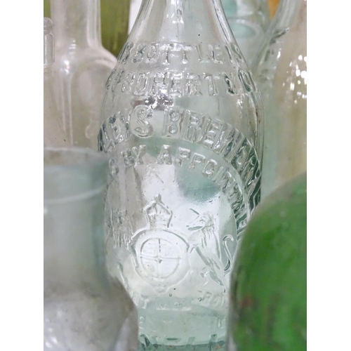 244 - A quantity of old bottles to include gingerbeers, codd, Princes Risborough milk bottle with original... 