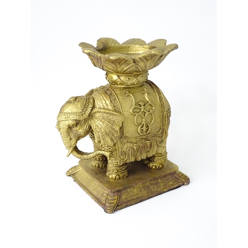 288 - A cast candle stand formed as an elephant and howdah, with gilded finish, approx 8