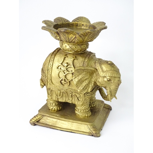 288 - A cast candle stand formed as an elephant and howdah, with gilded finish, approx 8