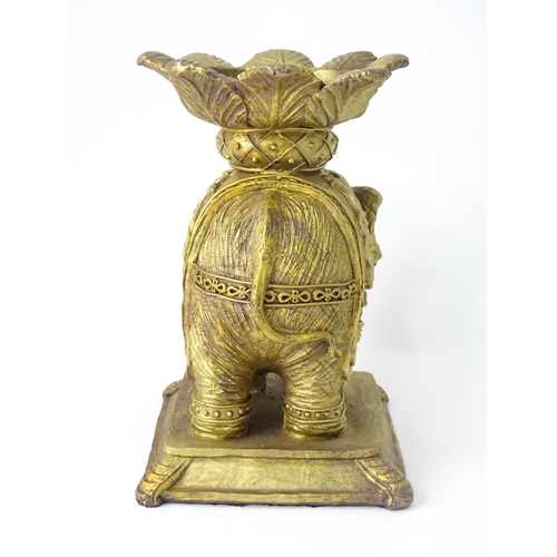 288 - A cast candle stand formed as an elephant and howdah, with gilded finish, approx 8