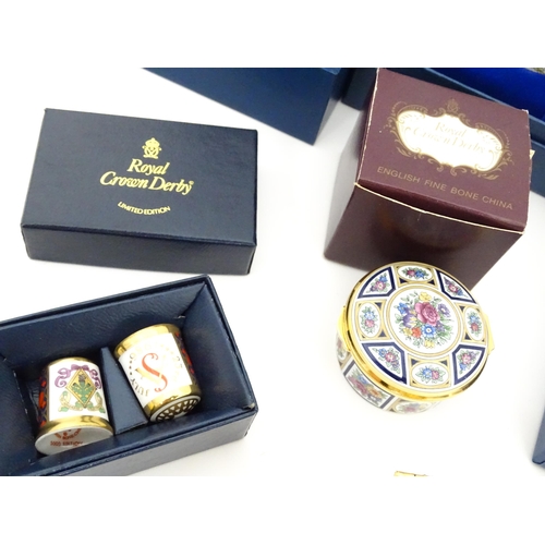 289 - A quantity of boxed Halcyon Days enamelled pill boxes and clock, together with boxed Royal Crown Der... 