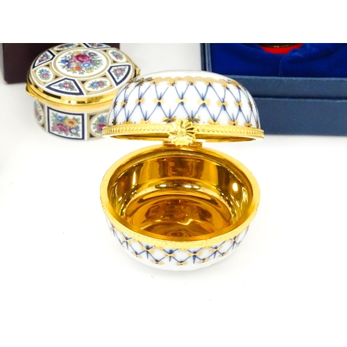 289 - A quantity of boxed Halcyon Days enamelled pill boxes and clock, together with boxed Royal Crown Der... 