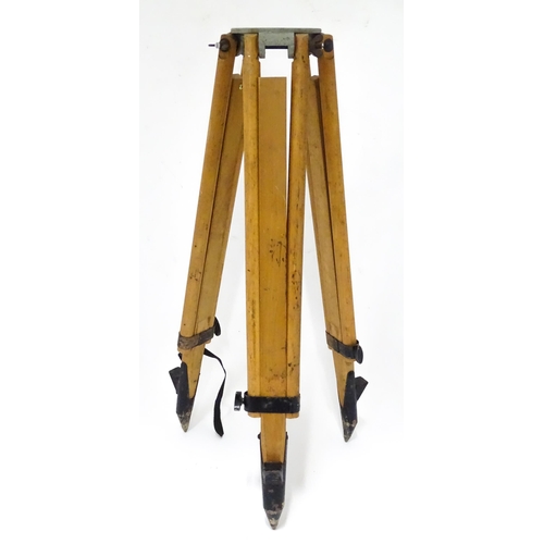 73 - A mid to late 20thC Stanley surveyor's tripod, constructed from maple with steel mounts, extending t... 