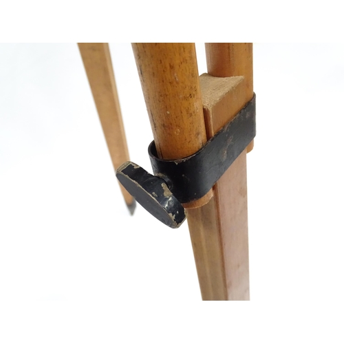 73 - A mid to late 20thC Stanley surveyor's tripod, constructed from maple with steel mounts, extending t... 