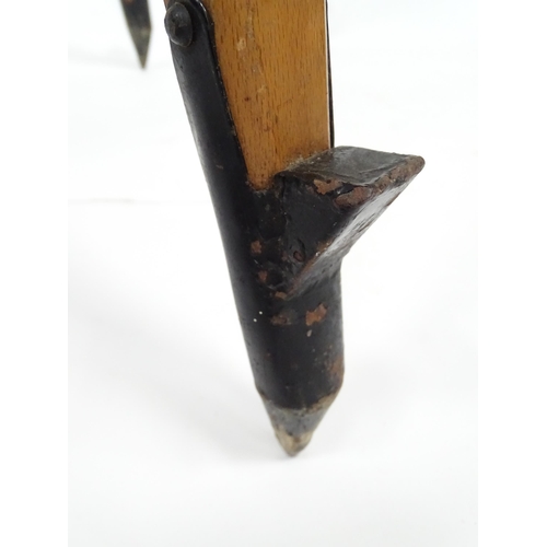 73 - A mid to late 20thC Stanley surveyor's tripod, constructed from maple with steel mounts, extending t... 