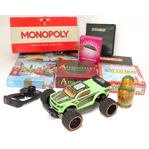 207 - A quantity of assorted board games to include Monopoly, Scrabble, etc. Together with a radio-control... 