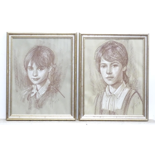 245 - A pair of 20thC pastel portraits. Signed and dated 1983 lower right. Approx 13 1/2