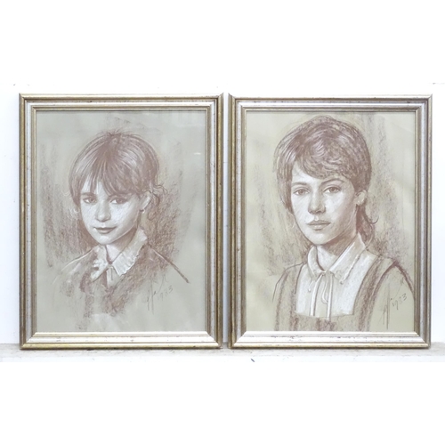 245 - A pair of 20thC pastel portraits. Signed and dated 1983 lower right. Approx 13 1/2