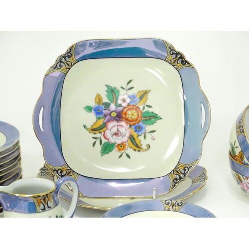 248 - A quantity of Noritake tea wares with floral decoration and lustre borders to include cups, saucers,... 