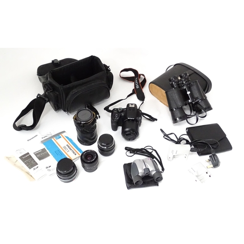 249 - A quantity of assorted cameras and accessories to include a Sony Alpha 3000 DSLR, a Sony DCR-SX44, a... 