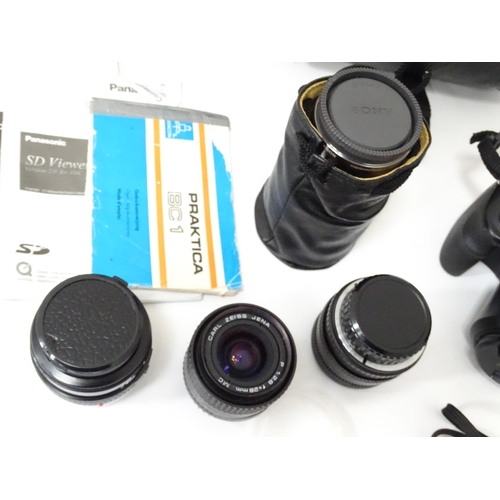 249 - A quantity of assorted cameras and accessories to include a Sony Alpha 3000 DSLR, a Sony DCR-SX44, a... 