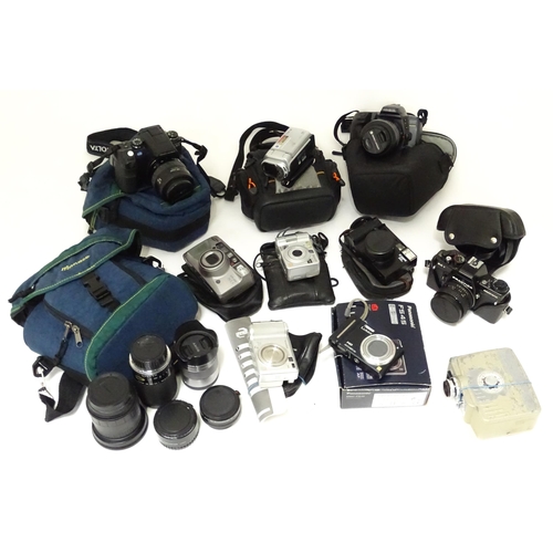 249 - A quantity of assorted cameras and accessories to include a Sony Alpha 3000 DSLR, a Sony DCR-SX44, a... 