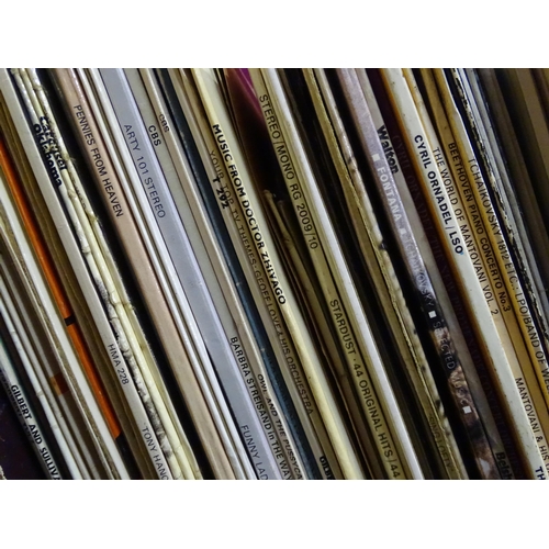 264 - A large quantity of mid to late 20thC vinyl 33rpm LPs / records and EPs / 45rpm singles , genres to ... 