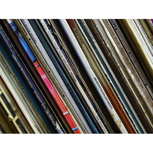 264 - A large quantity of mid to late 20thC vinyl 33rpm LPs / records and EPs / 45rpm singles , genres to ... 