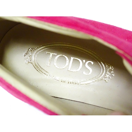 334 - Vintage Fashion: Two pairs of Tod's shoes to include a pair of pink suede lace-up boots in women's E... 