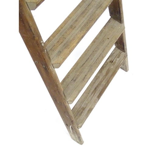 72 - A mid 20thC pine trestle stepladder, approx 67 1/2