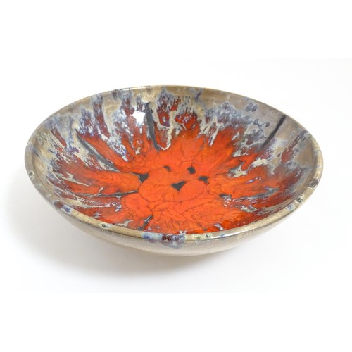 166 - A French Vallauris pottery bowl with Fat Lava style decoration. Marked under. Approx. 8