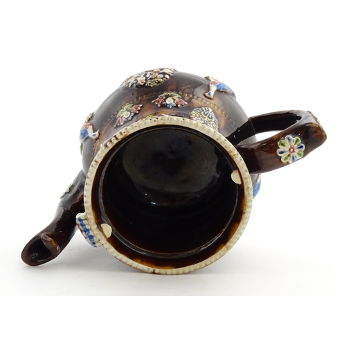 239 - A Measham bargeware commemorative teapot with teapot finial to lid, decorated with birds, flowers, f... 