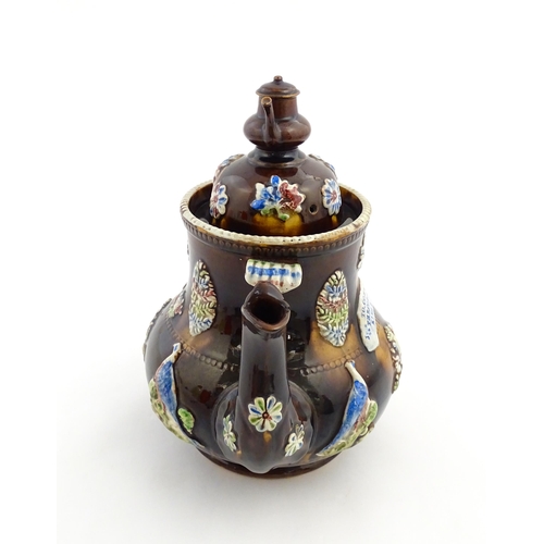 239 - A Measham bargeware commemorative teapot with teapot finial to lid, decorated with birds, flowers, f... 