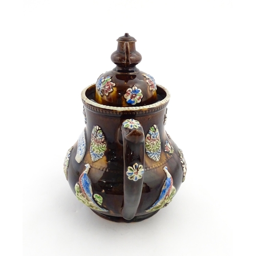 239 - A Measham bargeware commemorative teapot with teapot finial to lid, decorated with birds, flowers, f... 