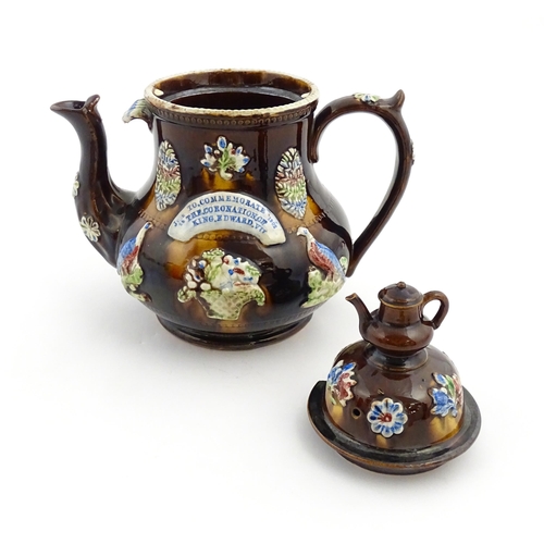 239 - A Measham bargeware commemorative teapot with teapot finial to lid, decorated with birds, flowers, f... 