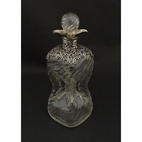 258 - A Victorian glass glug glug / pinch decanter with a pierced silver mount hallmarked London 1898, mak... 