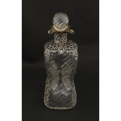 258 - A Victorian glass glug glug / pinch decanter with a pierced silver mount hallmarked London 1898, mak... 