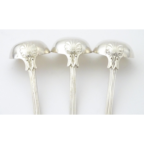 587 - Three 19thC Scottish silver King's pattern cream ladles hallmarked Glasgow 1830, maker WM AM. Approx... 