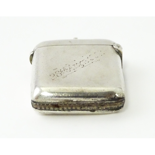 592 - A silver vesta case engraved 'Ashby W Warner, Norton, Stockton on Tees', hallmarked Chester 1900, ma... 