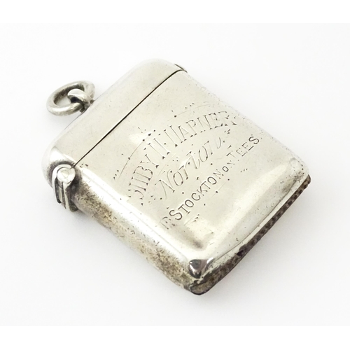 592 - A silver vesta case engraved 'Ashby W Warner, Norton, Stockton on Tees', hallmarked Chester 1900, ma... 