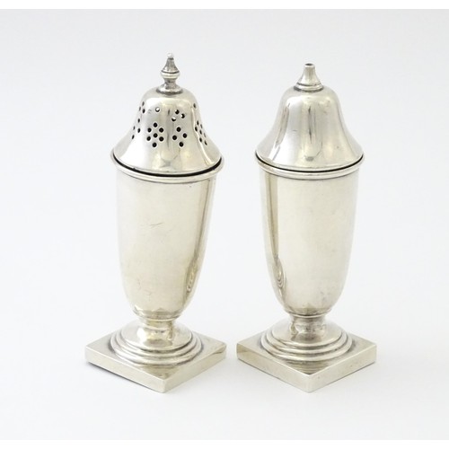 603 - A silver cruet set comprising salt and pepper, hallmarked Sheffield 1938, maker Viner's Ltd. Approx.... 