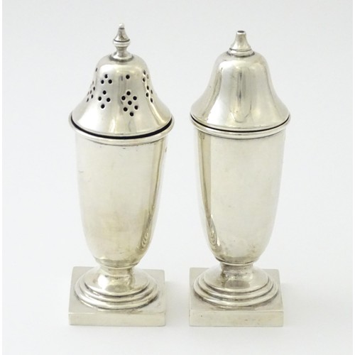 603 - A silver cruet set comprising salt and pepper, hallmarked Sheffield 1938, maker Viner's Ltd. Approx.... 