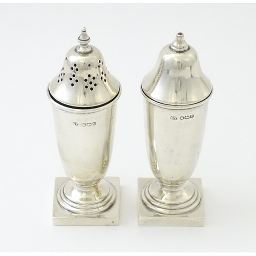 603 - A silver cruet set comprising salt and pepper, hallmarked Sheffield 1938, maker Viner's Ltd. Approx.... 