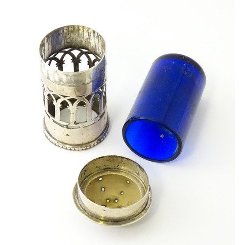 611 - A silver pepper with blue pierced decoration and glass liner, hallmarked Birmingham 1913, maker Henr... 