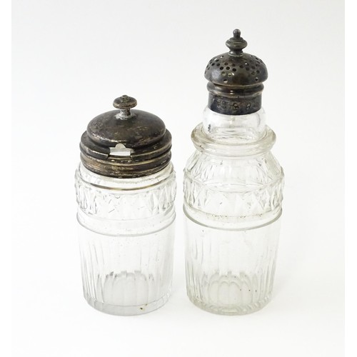 612 - Two glass cruet bottles with silver lids, one hallmarked Geo IV Sheffield 1827, maker Howard Battie ... 