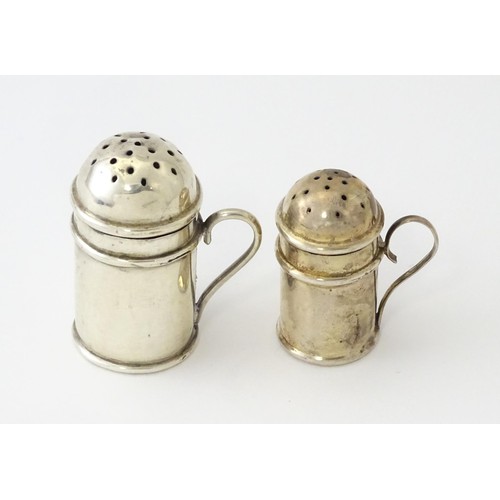 615 - Two small novelty silver pepperettes of flour shaker form, one Victorian example hallmarked Birmingh... 