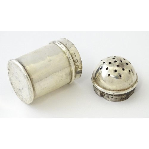 615 - Two small novelty silver pepperettes of flour shaker form, one Victorian example hallmarked Birmingh... 