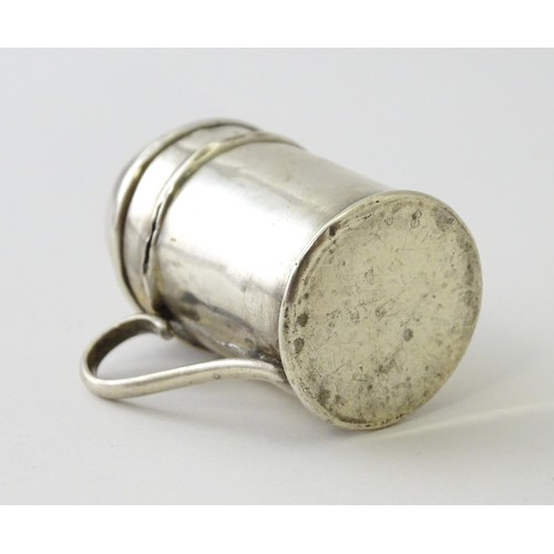 615 - Two small novelty silver pepperettes of flour shaker form, one Victorian example hallmarked Birmingh... 