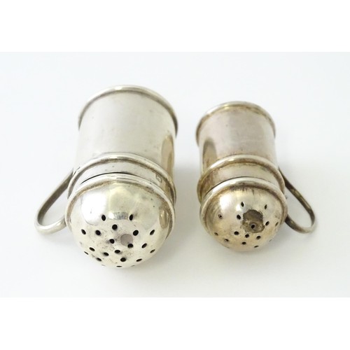 615 - Two small novelty silver pepperettes of flour shaker form, one Victorian example hallmarked Birmingh... 